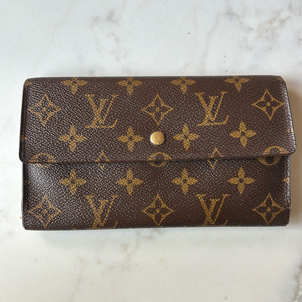 Used vintage Louis Vuitton monogram wallet check book.